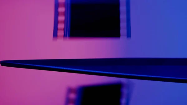 Scissors Cuts Strip Photographic Film Blue Pink Background Close — Stock Photo, Image