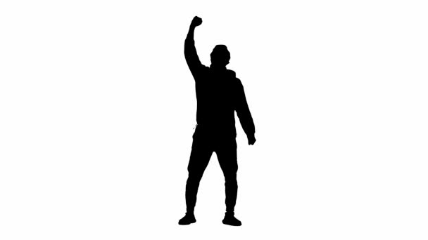 若いハイカーの黒いシルエットは喜んで勝利のジェスチャーを作り 空中に手を上げました 白い孤立した背景に立っている男 — ストック動画