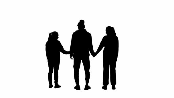 Μαύρη Σιλουέτα Μιας Ομάδας Τριών Ανθρώπων Που Κρατιούνται Χέρι Χέρι — Αρχείο Βίντεο