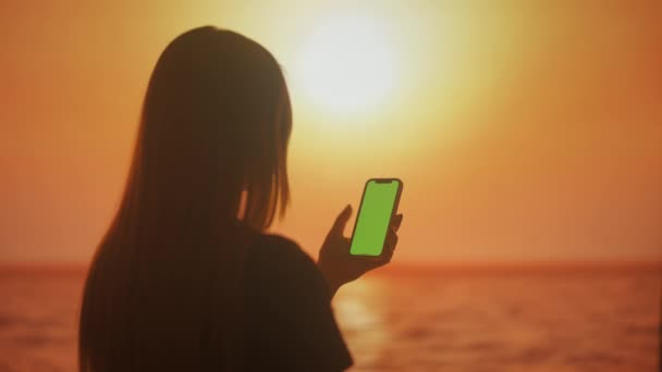 Silhouette Young Female Swiping Smartphone Screen Browsing Information Backdrop Bright — Stock Video