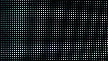 Dijital LED panelin makro görüntüsü. Resim, bir ızgarada sıralanmış RGB piksellerini vurgular. Ekranda yanıp sönen ve epileptik arızalar.