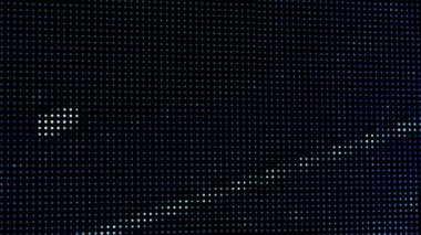 Bir makro çekim, dijital bir LED ekranın canlı RGB noktalarını yakalar. Resim, toplu olarak yüksek çözünürlüklü görsel görüntüler yaratan bireysel pikselleri gösterir.