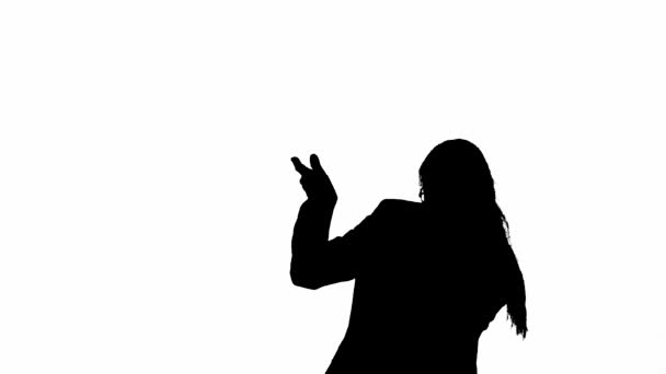 穿着黑色西装的女人兴高采烈地跳舞 现代女商人创意广告理念 白色孤立背景上的黑色轮廓 — 图库视频影像