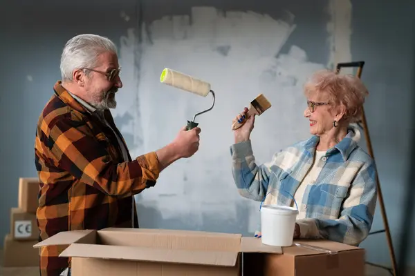 Older Couple Enjoys Unpacking Boxes Home Renovation Sharing Joyful Moment Royalty Free Stock Images