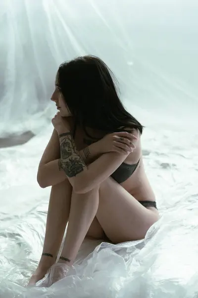 Young Woman Dark Hair Visible Tattoos Sits Hugging Her Knees Royalty Free Stock Images