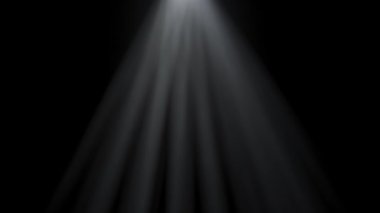 Yumuşak yayılmış ışık ışınları puslu karanlığın içinden geçiyor. Projektörden gelen ışınlar karanlıkta duman ve ince toz parçacıklarıyla parlıyor. Sinematik ışık.