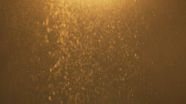 Dumanlı havada rastgele uçuşan küçük toz bulutu, nesneler için boş uzay şablonu. Birçok toz tanecikleri yukarıdan gelen spot ışıklarıyla boş altın arka planda sıcak ışıkta yüzerler..