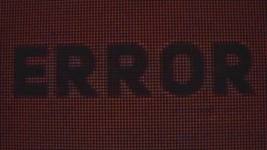 Kırmızı ve siyah renklerde gösterilen pikselli grafik hatası bir dijital hata efekti oluşturur. Makro