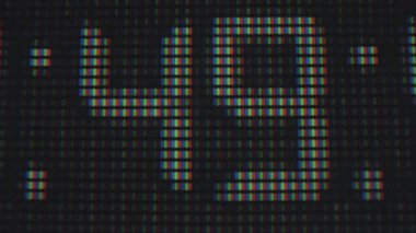 Bir ızgara düzeninde bireysel RGB alt piksellerini vurgulayan dijital bir pikselin ayrıntılı makro görüntüsü. Makro
