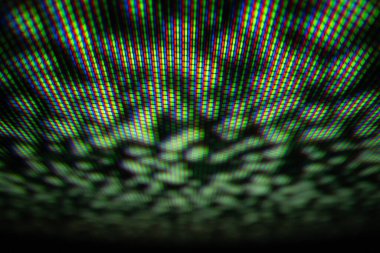 Dijital ekran teknolojisinde kırmızı, yeşil ve mavi renkleri gösteren RGB piksel düzeninin ayrıntılı bir makro görüntüsü.