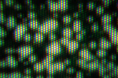 Bu yakın plan resim, canlı renkleri ve modern ekran teknolojisini vurgulayan detaylı bir RGB pikseli deseni sergiliyor.