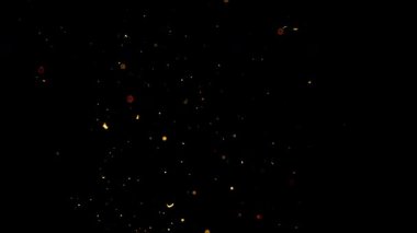 Havada asılı duran altın toz parçacıkları siyah bir zemin üzerinde sihirli ve atmosferik bir görsel etki yaratıyor..