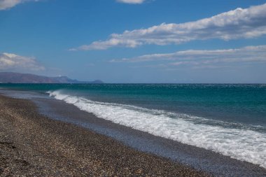 Beautiful seascape. Coast of the island of Crete - Greece area of Lerapetra Eden Rock. There are dramatic clouds in the sky.