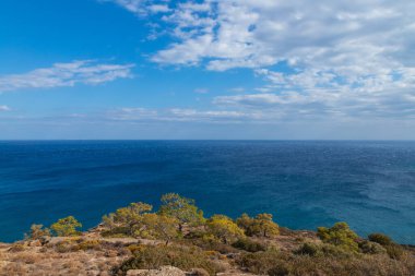 Beautiful seascape. Coast of the island of Crete - Greece area of Lerapetra Eden Rock. There are dramatic clouds in the sky.