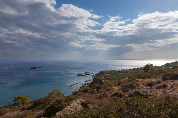 Beautiful seascape. Coast of the island of Crete - Greece area of Lerapetra Eden Rock. There are dramatic clouds in the sky.