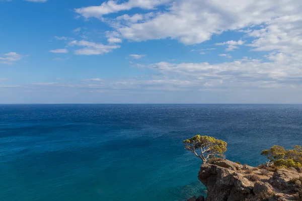 Beautiful seascape. Coast of the island of Crete - Greece area of Lerapetra Eden Rock. There are dramatic clouds in the sky.