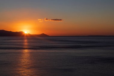 Beautiful landscape. Coast of the island of Crete - Greece area of Lerapetra Eden Rock. Beautiful sky at sunrise over the sea.