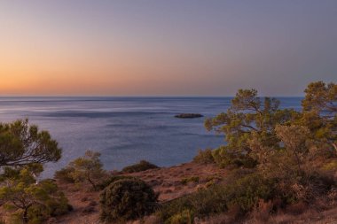 Beautiful landscape. Coast of the island of Crete - Greece area of Lerapetra Eden Rock. Beautiful sky at sunrise over the sea.