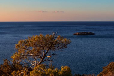Beautiful landscape. Coast of the island of Crete - Greece area of Lerapetra Eden Rock. Beautiful sky at sunrise over the sea.