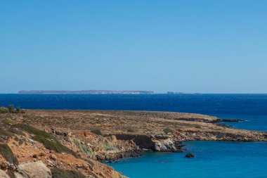 Beautiful landscape. Coast of the island of Crete - Greece area of Lerapetra Eden Rock. Beautiful sky at sunrise over the sea.