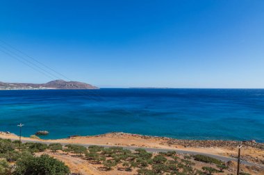 Beautiful landscape. Coast of the island of Crete - Greece area of Lerapetra Eden Rock. Beautiful sky at sunrise over the sea.