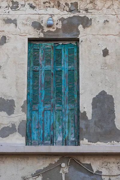 Old colorful door. The paint on the door is chipped.
