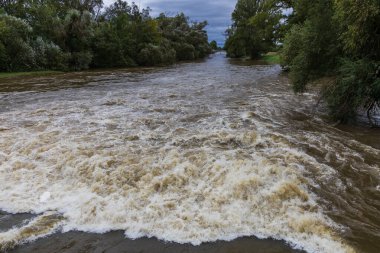 River Svratka and Svitava in the city of Brno, Czech Republic. Diluted water during the rainy season. clipart