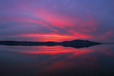 Beautiful colorful sky over the lake at sunset. Musov and view of the Palava landscape clipart