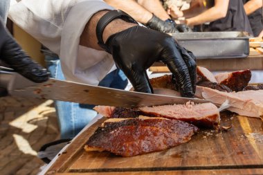 Grilled pGrilled pork meat sliced on a cutting boardork meat sliced on a cutting board