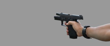 Isolated automatic 9mm pistol gun holding in right hand with clipping paths. concept for using pistol to protect properties and humans in crisis situations around the world.