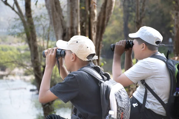 Asian Boy Plaid Shirt Wears Cap Has Backpack Holding Binoculars — Photo