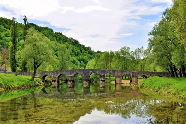 stock image Old stone bridge over the Dobra river in Novigrad, Croatia