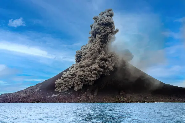 The Anak Krakatau volcano with a plume of smoke. Indonesia