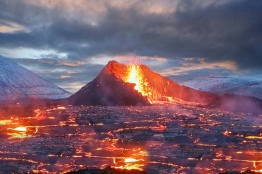 Eruption under an overcast winter sky of the Geldingadalir volcano with a sea of lava in the Fagradalsfjall volcanic system, Reykjanes Peninsula, Iceland. clipart