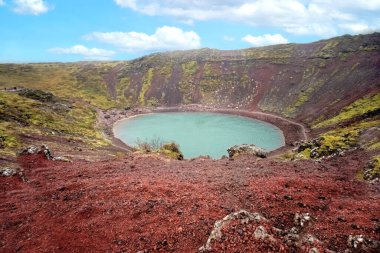 Kerid is a small volcanic crater in Iceland with a lake at the bottom. It is located in southwest Iceland. clipart