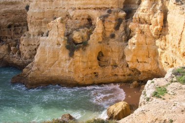 Rock formation next to the Atlantic Ocean on a winter day in Carvoeiro, Portugal.