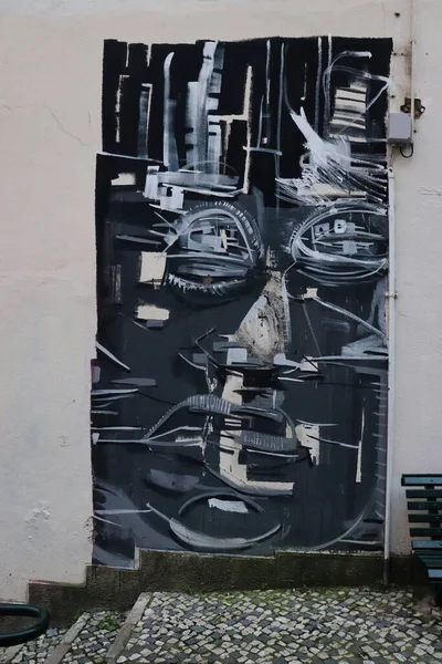 stock image Lisbon, Portugal - December 23, 2019: Artwork on a wall next to stairs in Lisbon, Portugal.