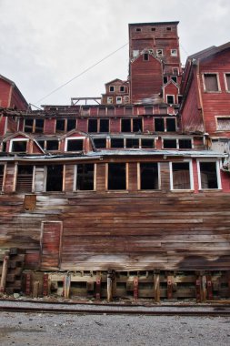 Kennecott, Alaska - July 13, 2023: Old wooden building in the abandoned copper mining camp of Kennecott in Wrangell-St. Elias National Park and Preserve. clipart