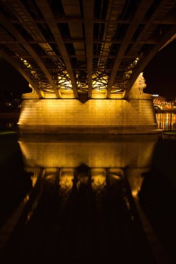 Budapest, Hungary - October 25, 2021: Bottom of the Margaret Bridge illuminated over the Danube River in Budapest.  clipart