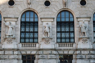 Vienna, Austria - October 9, 2021: Statues and windows on the front of Hofburg in Vienna.  clipart