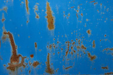 Kırık mavi, paslı yüzeyi olan eski metal bir doku.