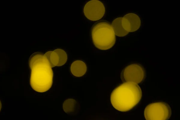 Żółte Rozmyte Światła Bokeh Czarnym Tle — Zdjęcie stockowe