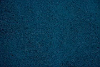 Blue colored abstract wall background with textures of different shades of blue