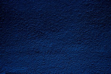Blue colored abstract wall background with textures of different shades of blue