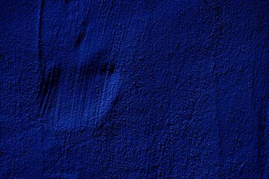 Blue colored abstract wall background with textures of different shades of blue