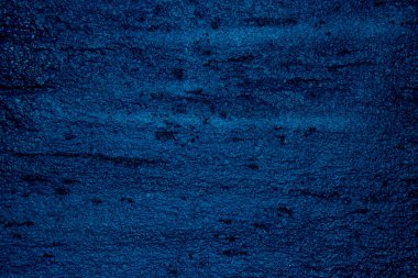 Blue colored abstract wall background with textures of different shades of blue