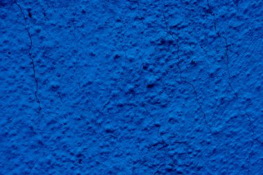 Blue colored abstract wall background with textures of different shades of blue