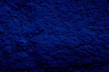 Blue colored abstract wall background with textures of different shades of blue
