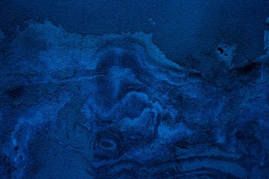 Blue colored abstract wall background with textures of different shades of blue