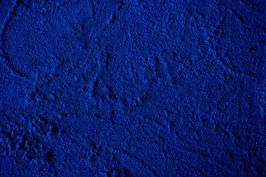 Blue colored abstract wall background with textures of different shades of blue